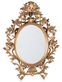 A Continental Baroque Style Giltwood Mirror