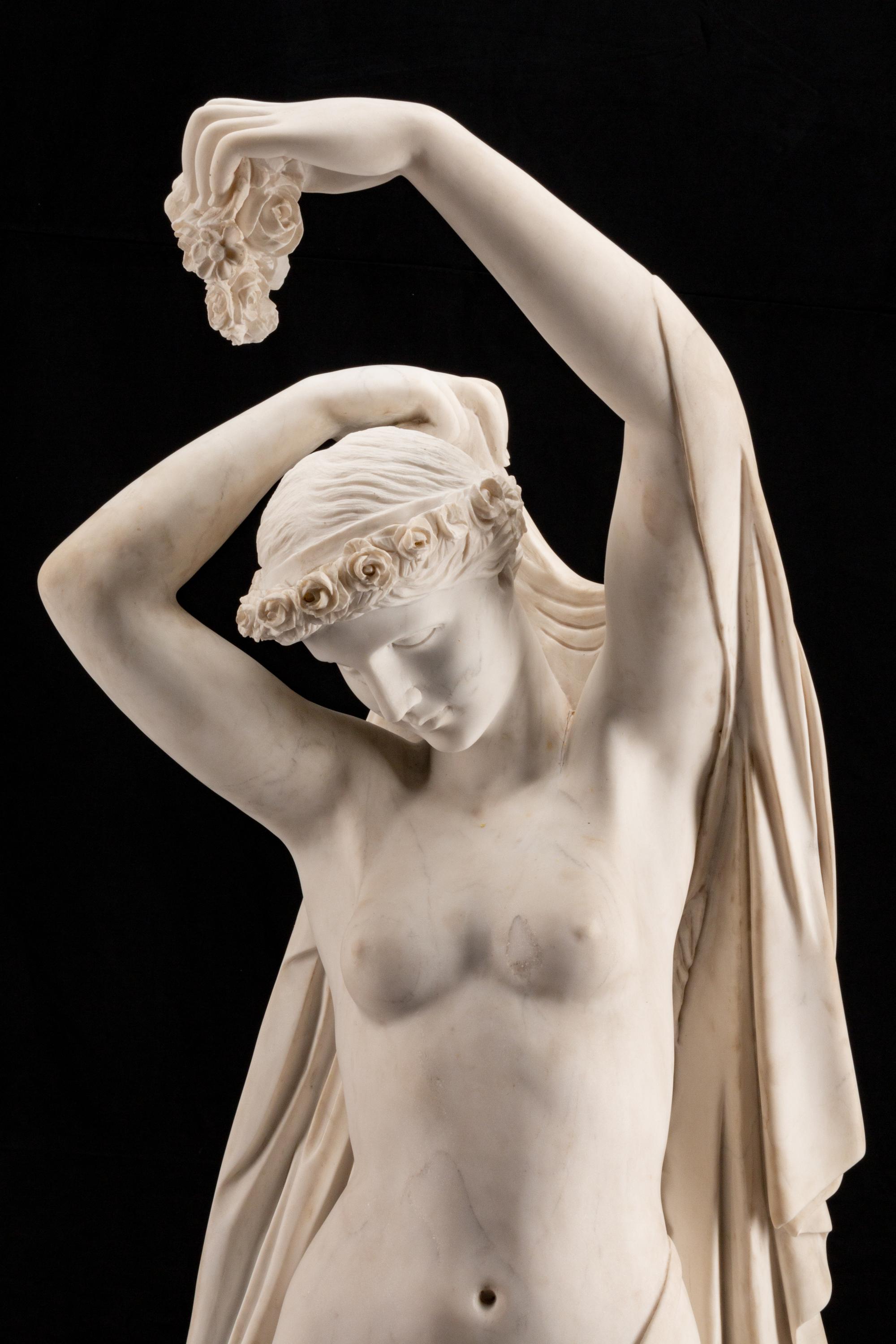An Italian Marble Figure of Flora and an Infant Attendant