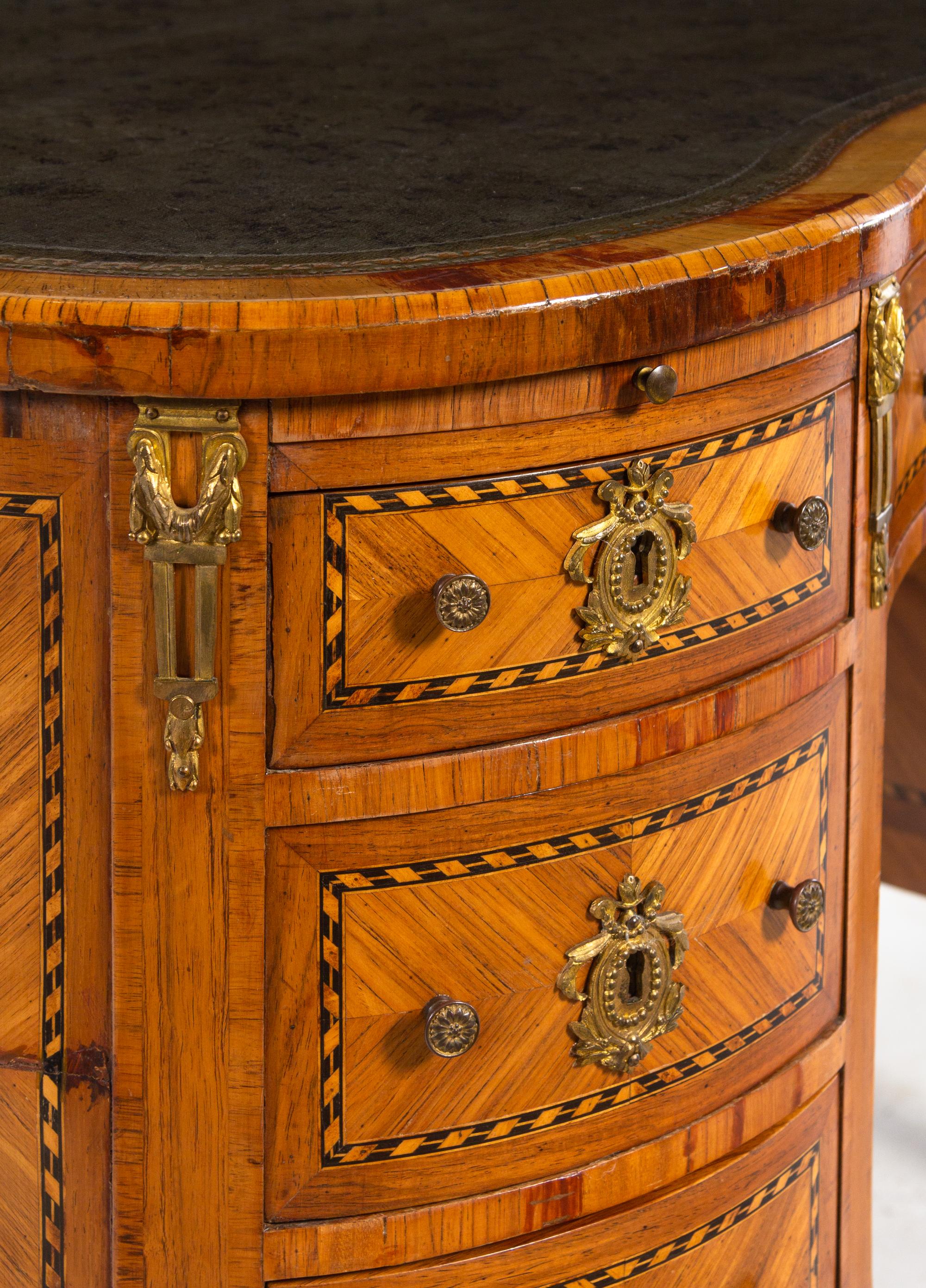 A Louis XV/XVI Transitional Style Kingwood and Parquetry Leather-Inset Reniform Bureau