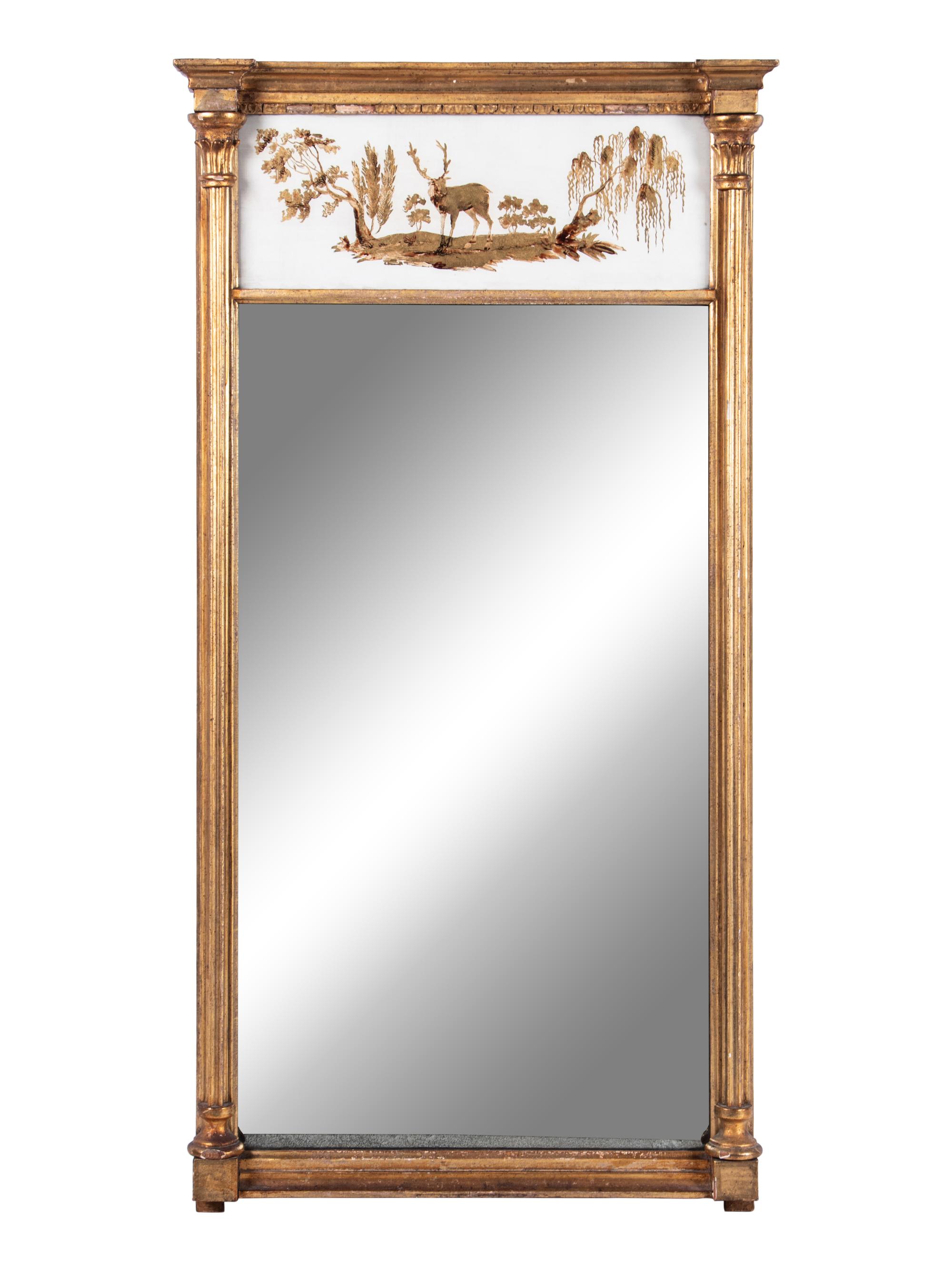 A Classical Giltwood and Eglomise Panel Inset Looking Glass