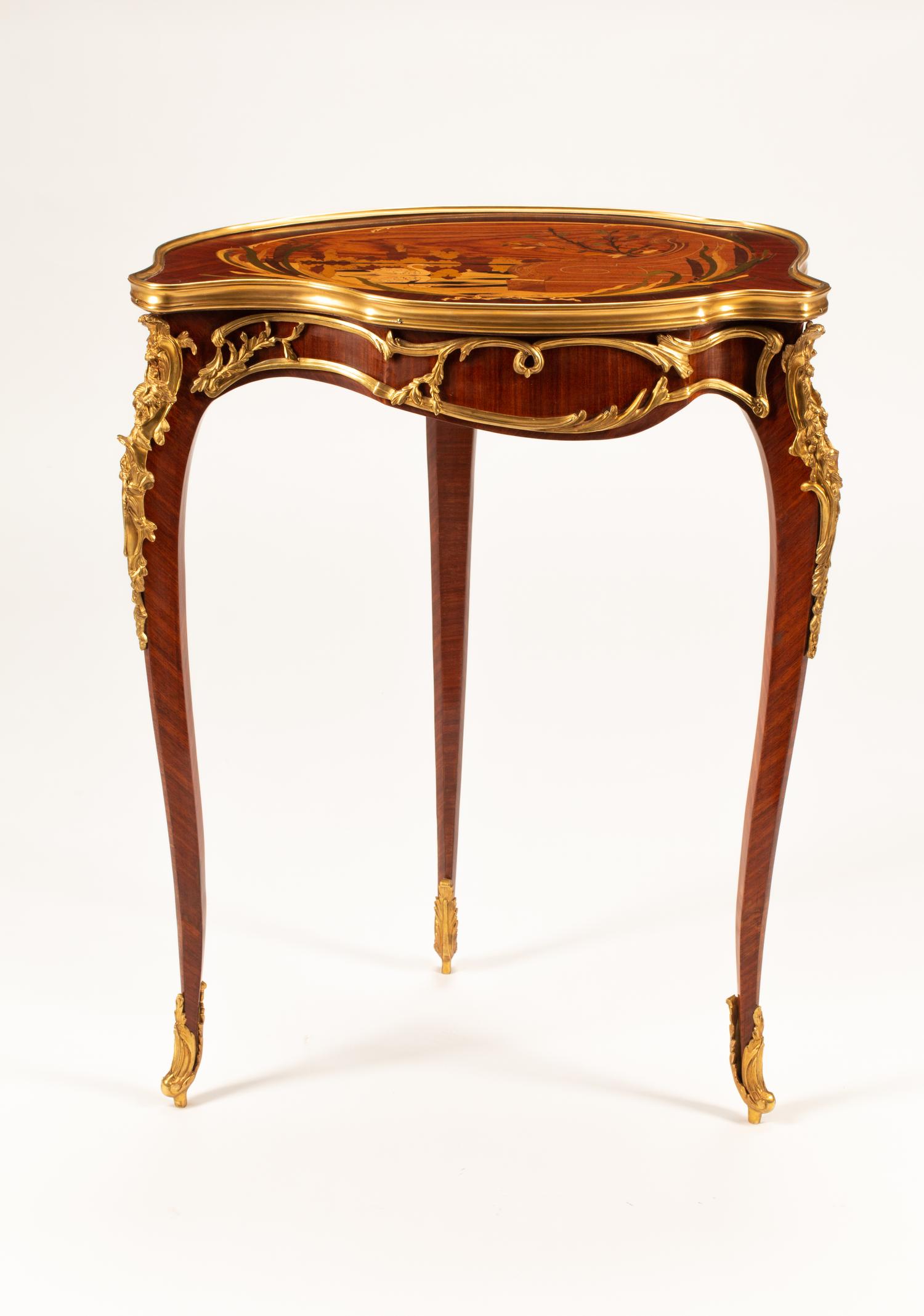 A Louis XV Style Marquetry Cartouche Table