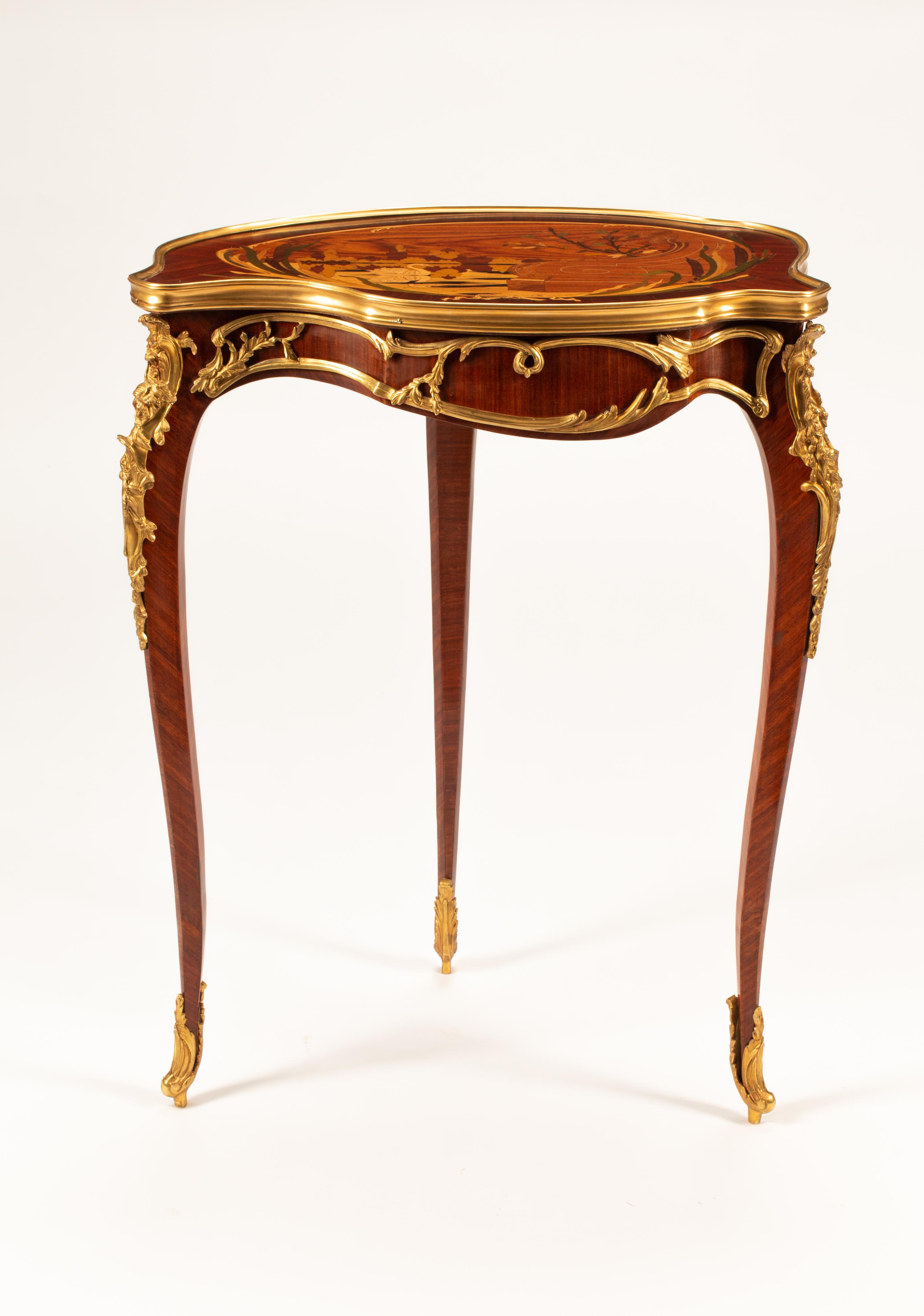 A Louis XV Style Marquetry Cartouche Table