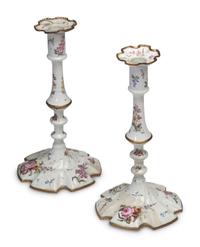 A Pair of Battersea Enamel Candlesticks