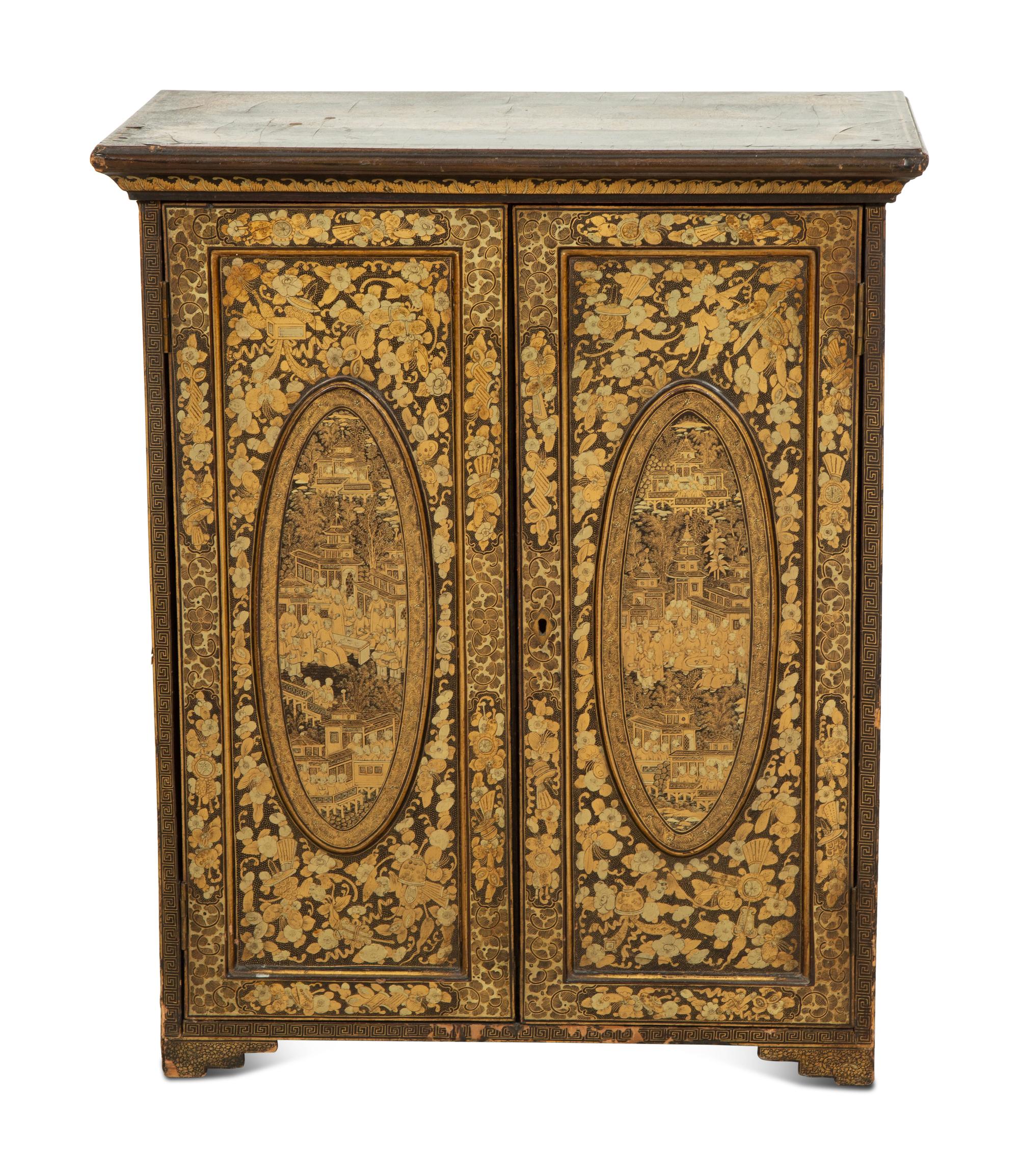 An English Black and Gilt Chinoiserie Decorated Cabinet with Interior Drawers