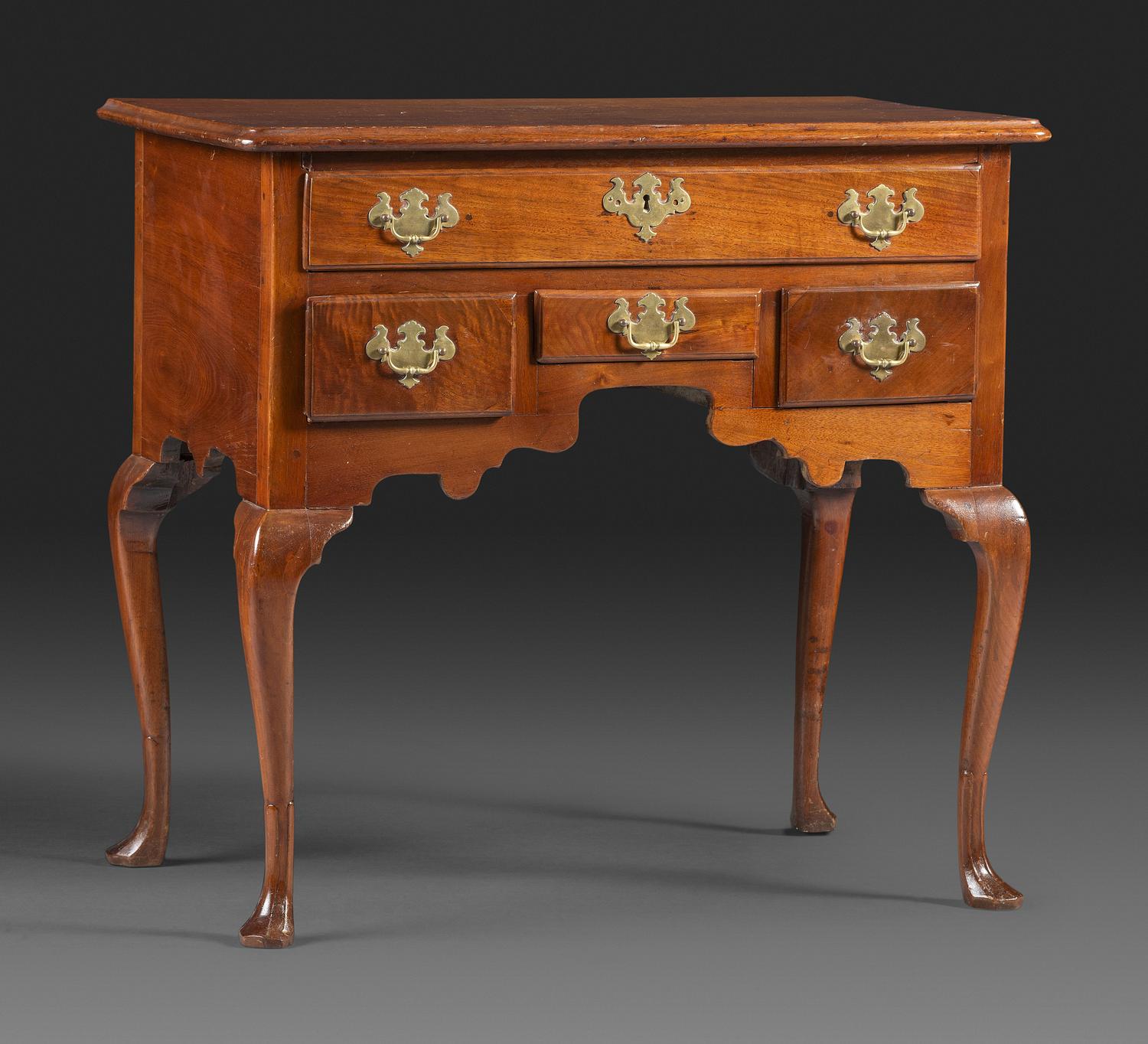 A Queen Anne Carved and Figured Walnut Dressing Table