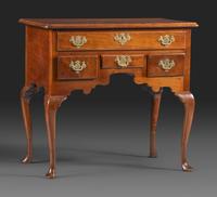 A Queen Anne Carved and Figured Walnut Dressing Table