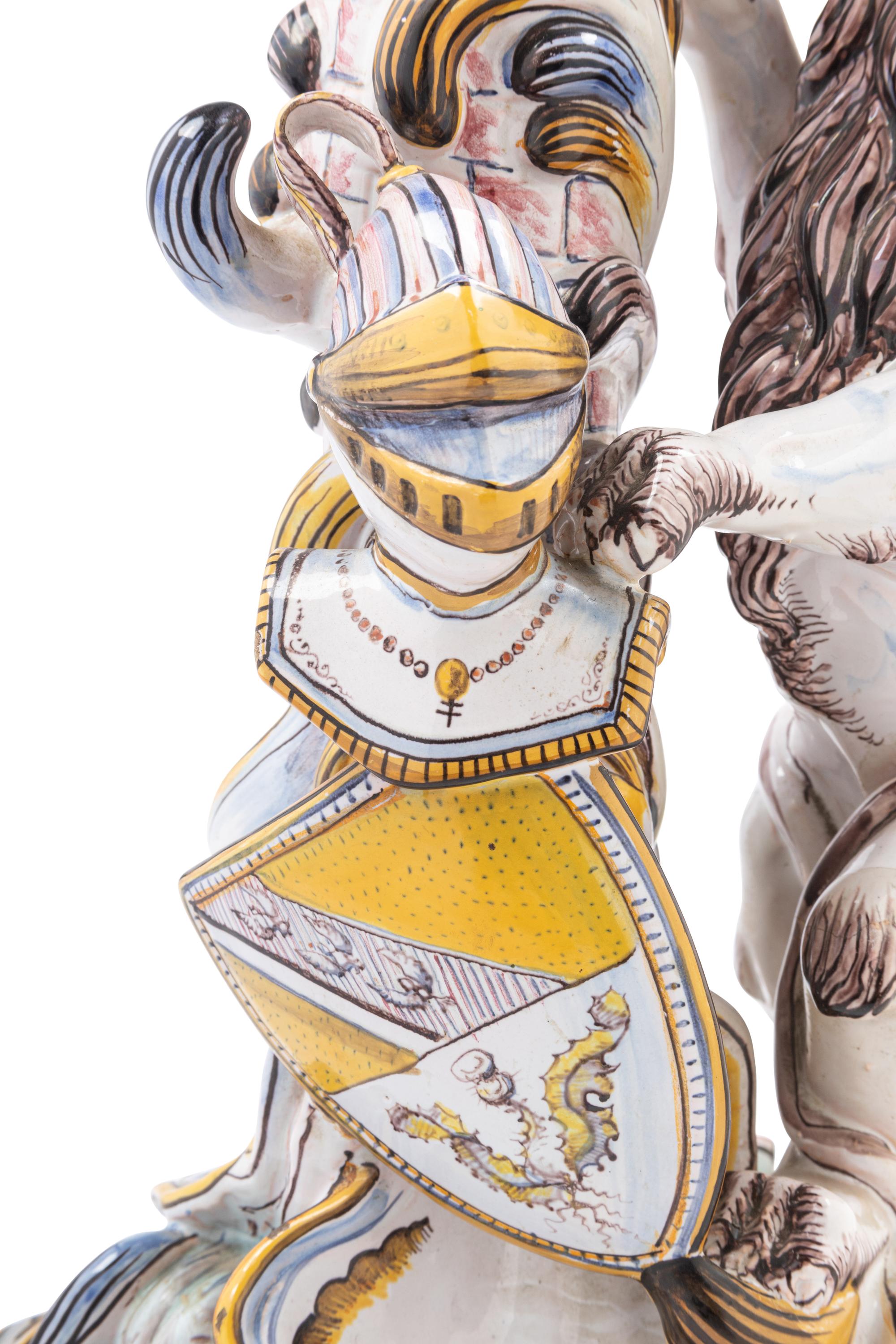 A Pair of French Faience Lion Ornaments