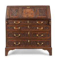 An Anglo-Indian Style Carved Oak and Marquetry Fall-Front Bureau