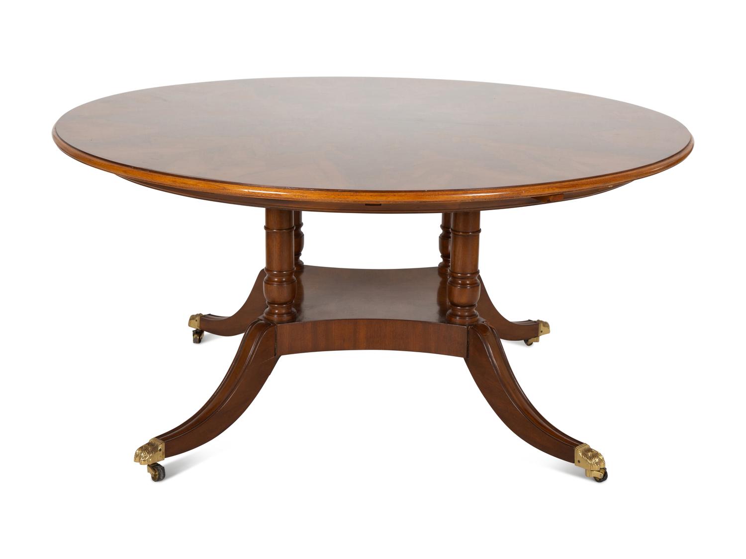 A Pair of Regency Style Mahogany Circular Dinner Tables