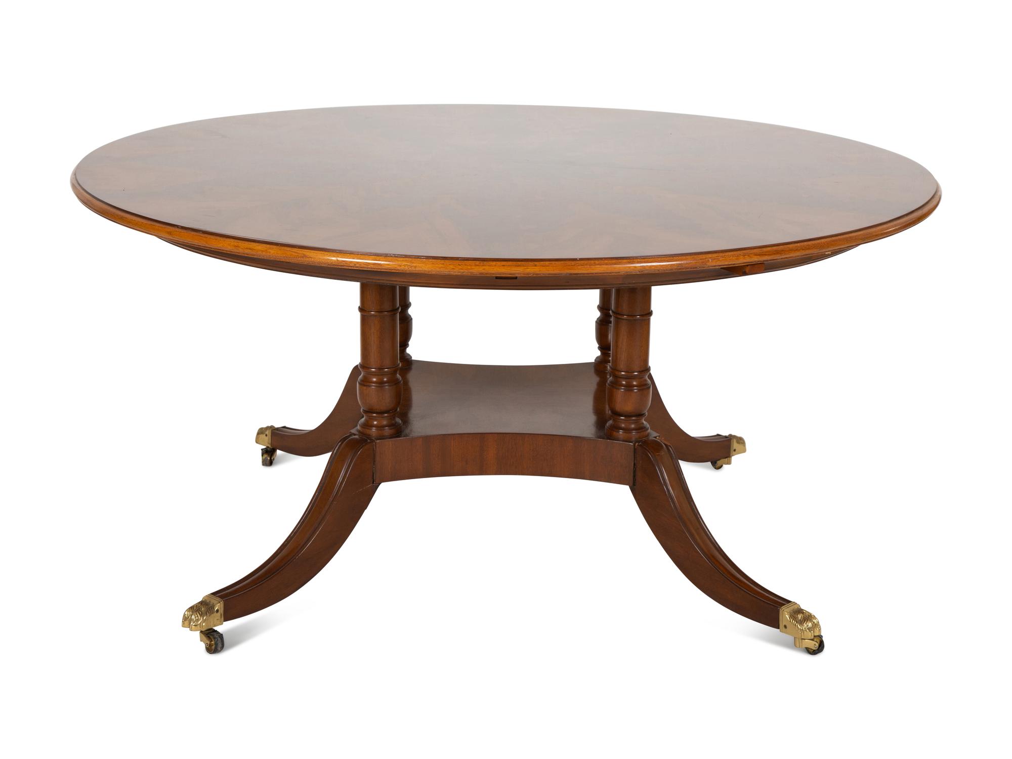 A Pair of Regency Style Mahogany Circular Dinner Tables