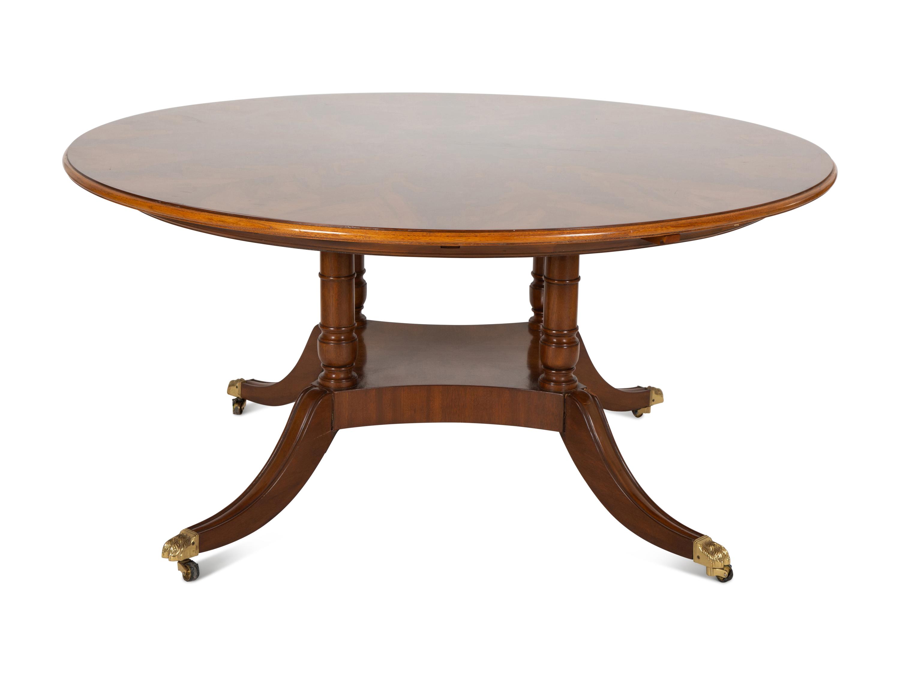 A Pair of Regency Style Mahogany Circular Dinner Tables