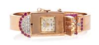 A Retro 14 Karat Rose Gold, Ruby and Diamond Surprise Bangle Bracelet Watch, Seeland, 34.85 dwts.