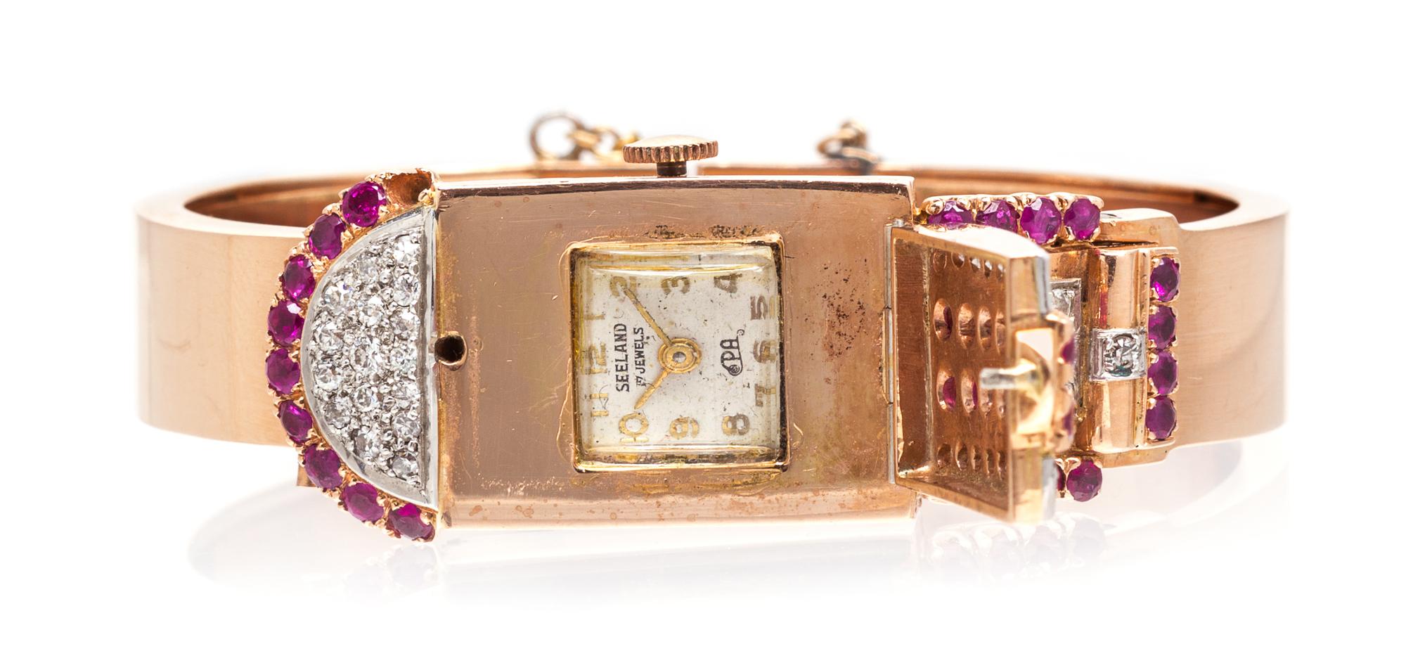 A Retro 14 Karat Rose Gold, Ruby and Diamond Surprise Bangle Bracelet Watch, Seeland, 34.85 dwts.