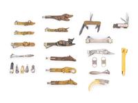 A Group of Twenty-One Brass, Bronze, and Silver Cigar Cutters
