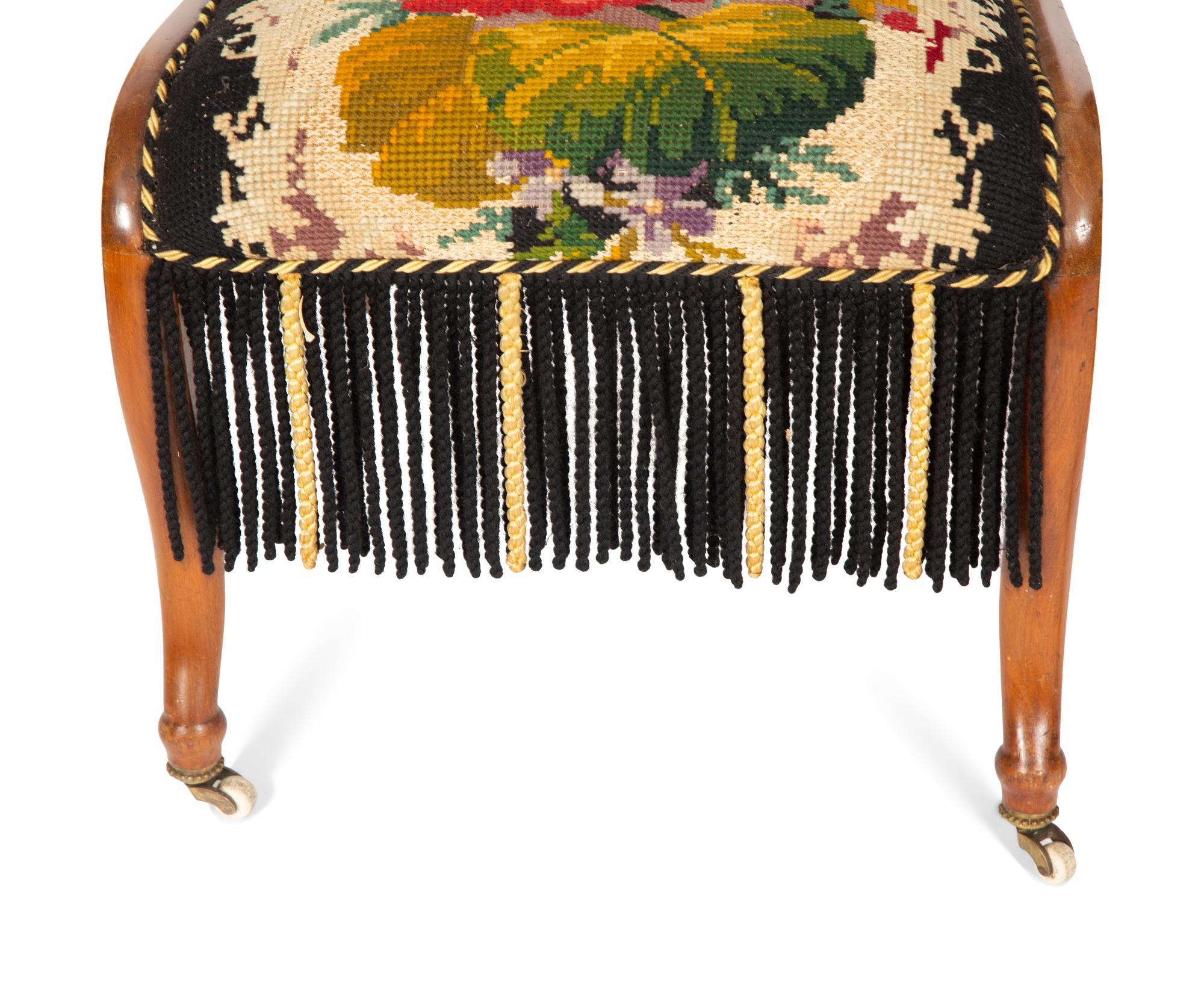 A Pair of Danish Walnut Slipper Chairs with Needlepoint Upholstery