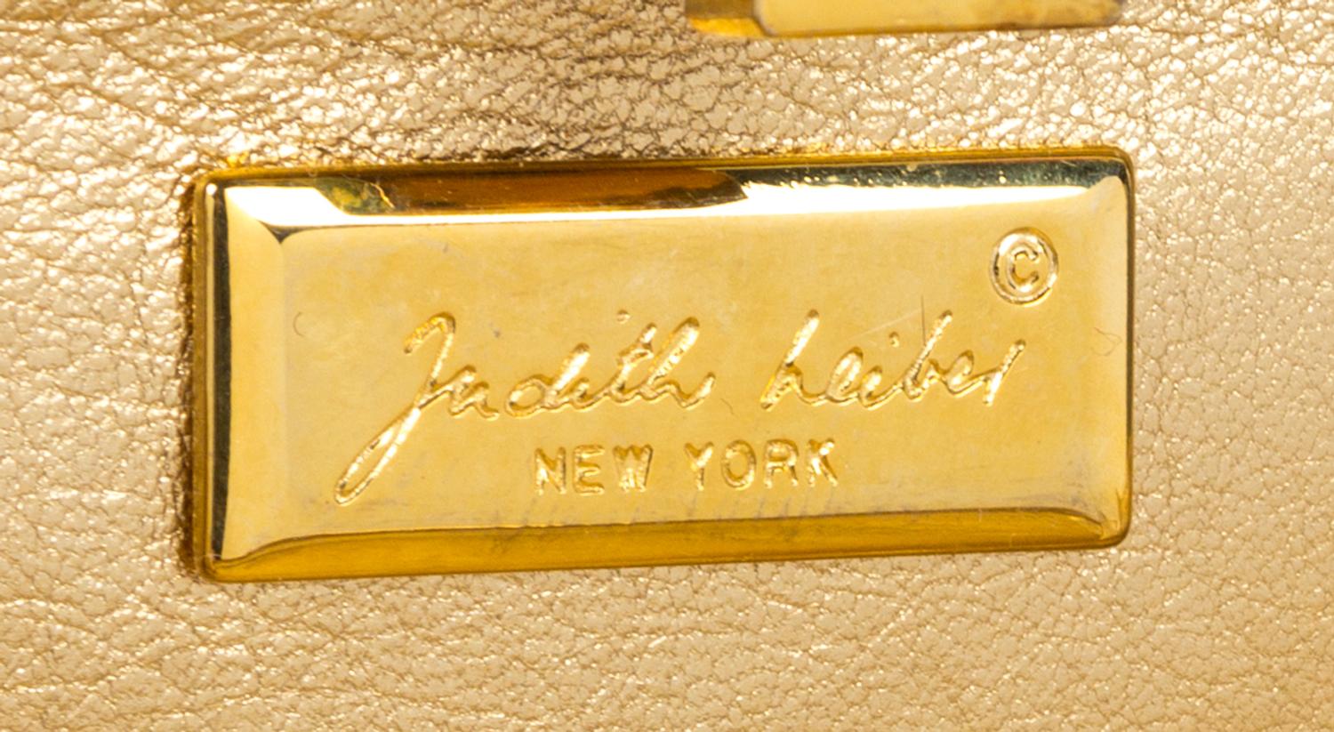 A Judith Leiber Clear Crystal Minaudiere, 7" x 4.25" x 1".