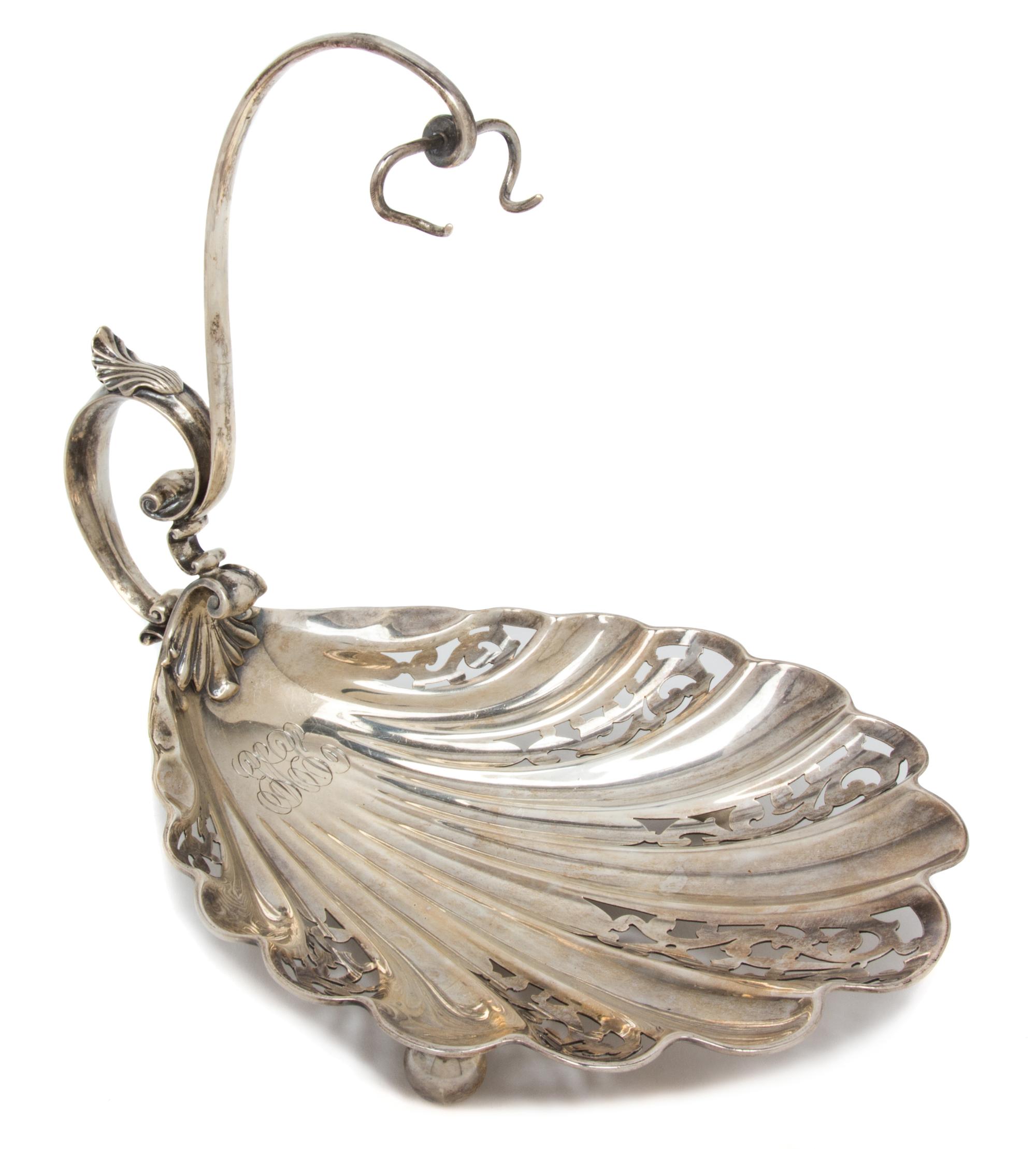 An American Silver Shell-Form Serving Dish, Durgin, Circa 1900, with scroll handle and pierced bowl, retailed by Tilden-Thurber Co.