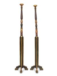 A Pair of Neoclassical Style Black and Gilt Torcheres