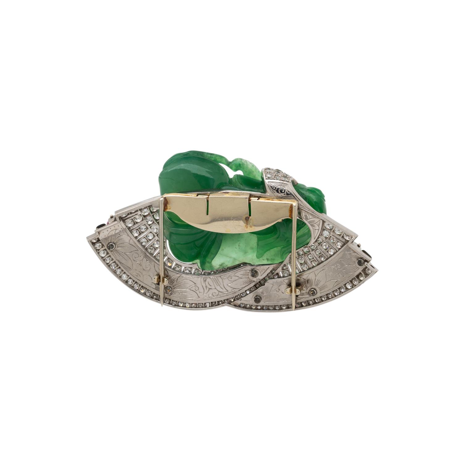 CARVED JADE, RUBY, DIAMOND, AND BLACK ENAMEL CLIP BROOCH