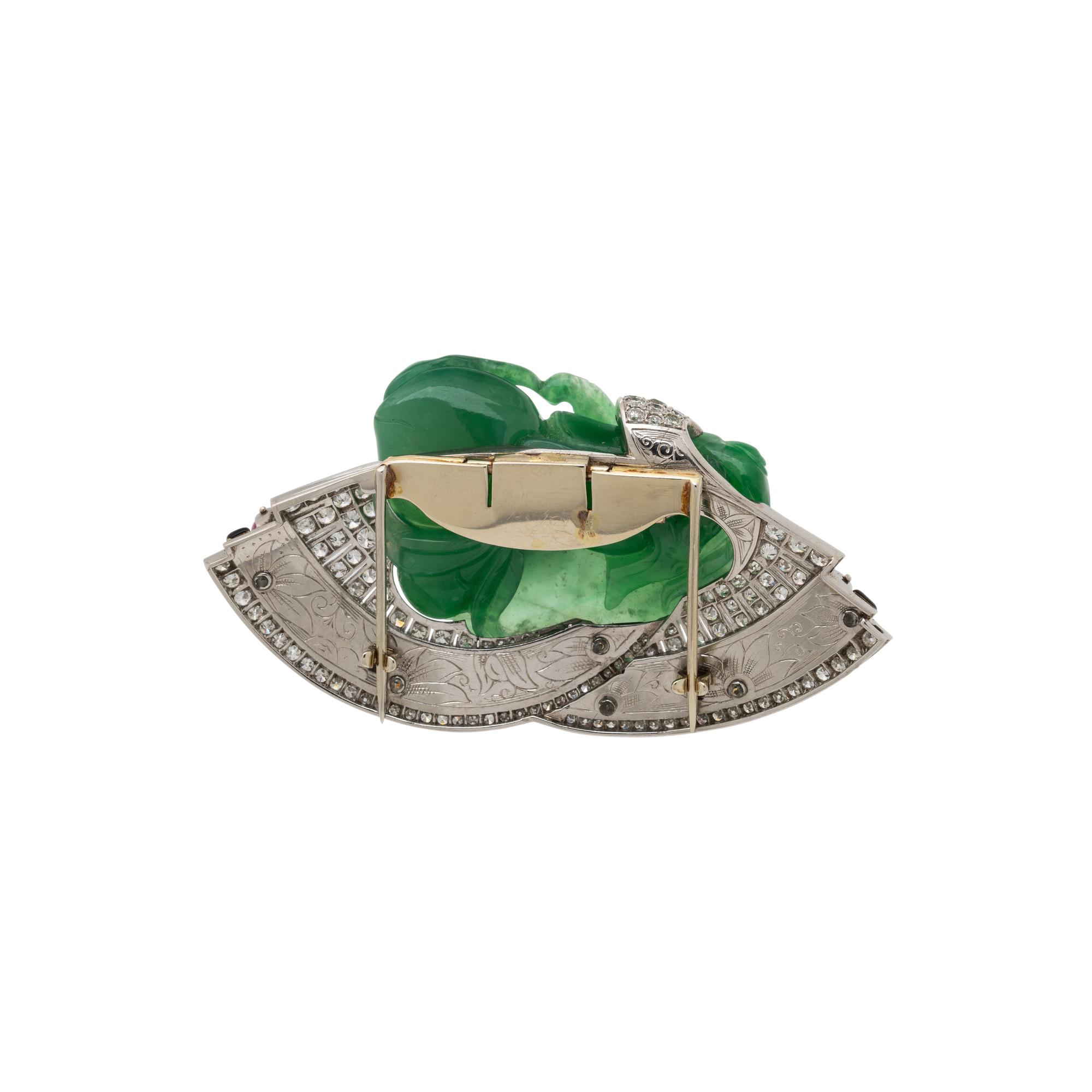 CARVED JADE, RUBY, DIAMOND, AND BLACK ENAMEL CLIP BROOCH