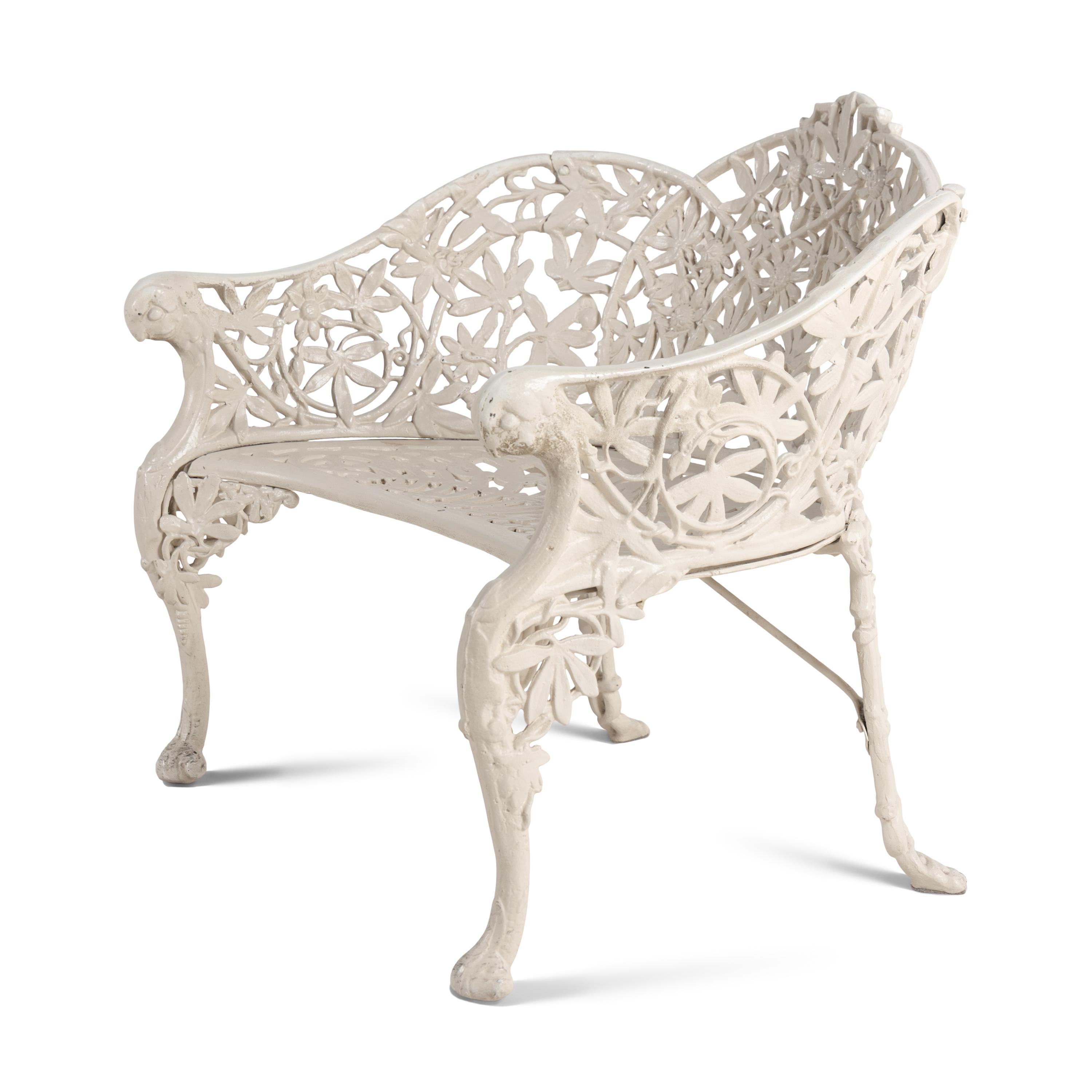 A Four-Piece Cast Iron Garden Seating Suite