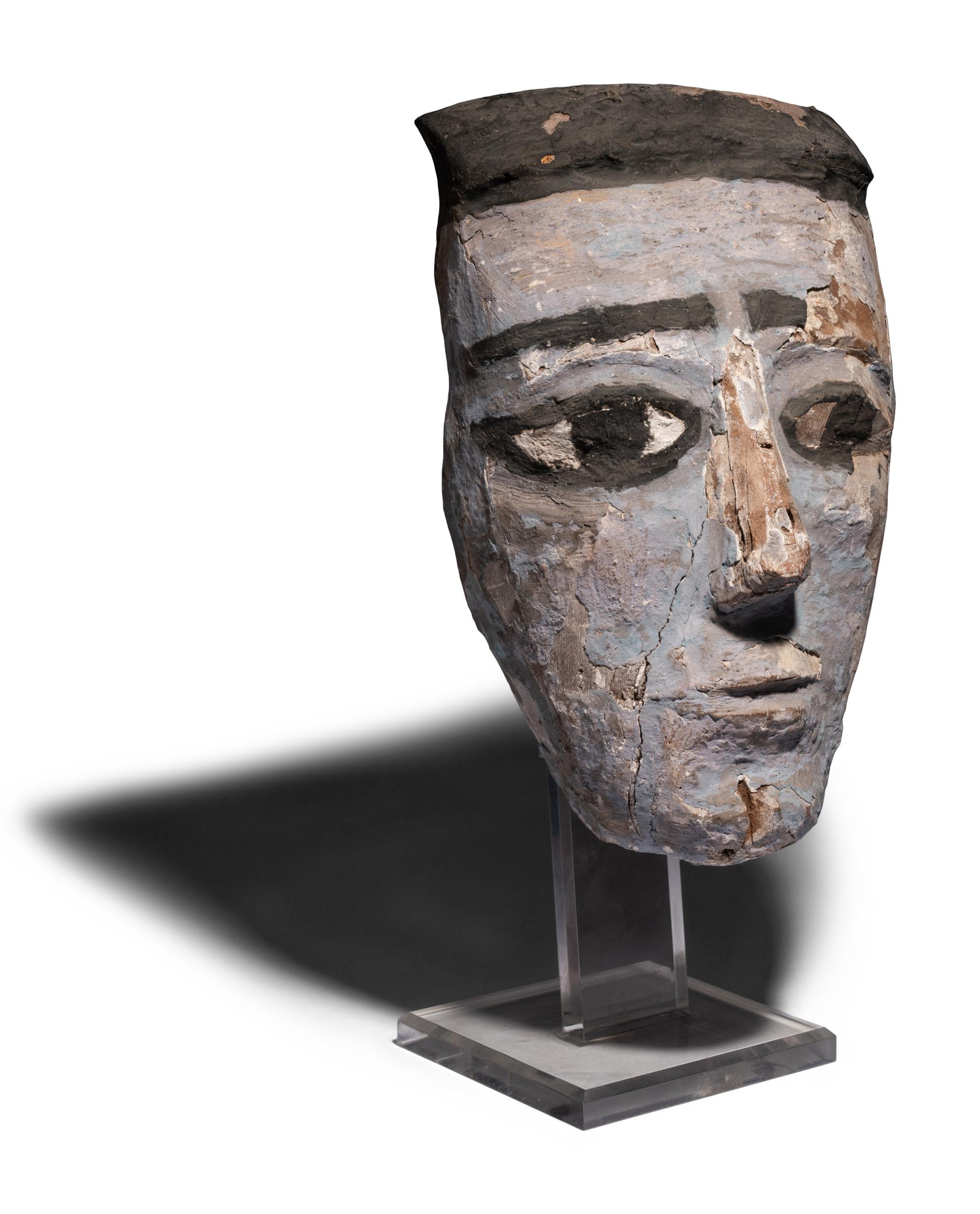An Egyptian Painted Wood Mummy Mask