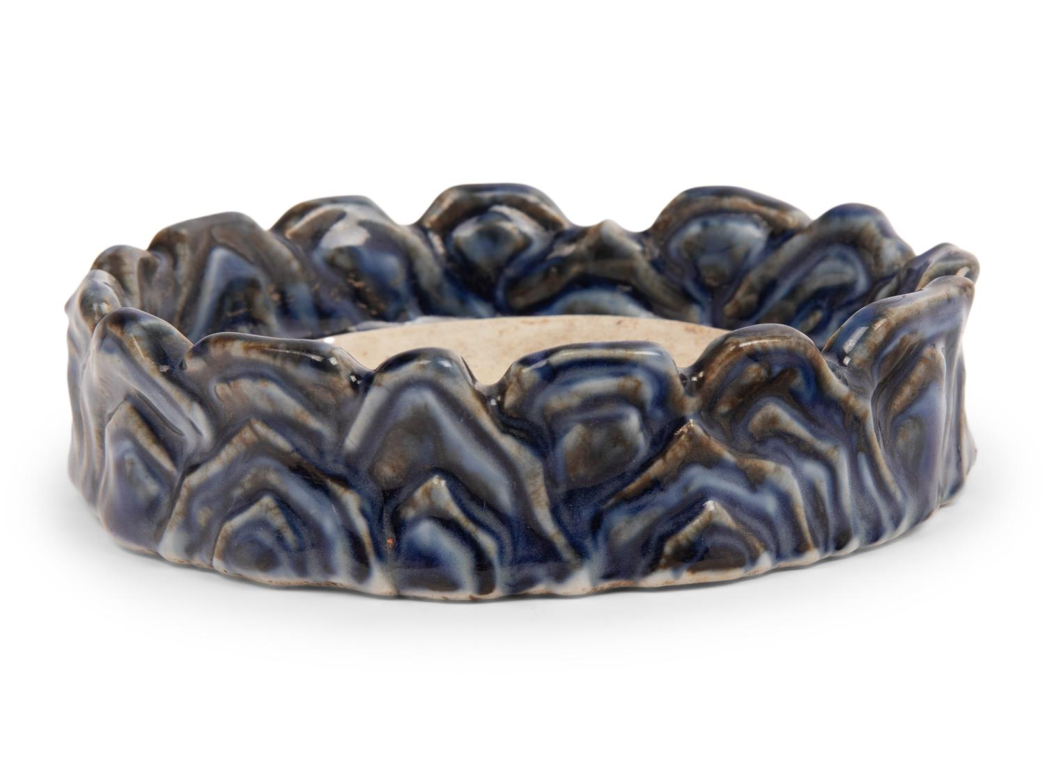 A Underglaze Red and Blue Porcelain 'Wave'-Form Inkstone