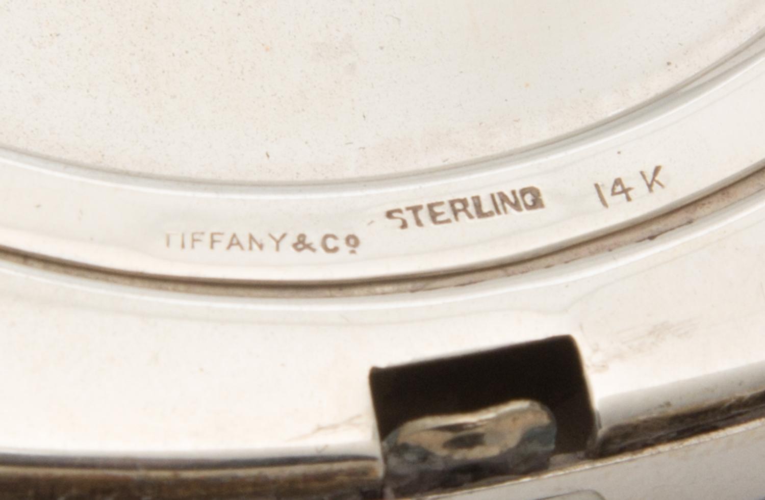 An American Silver, 14-Karat Gold and Ruby Inset Compact, Tiffany & Co., New York, NY, 20th Century, the engine turned lid with an appl