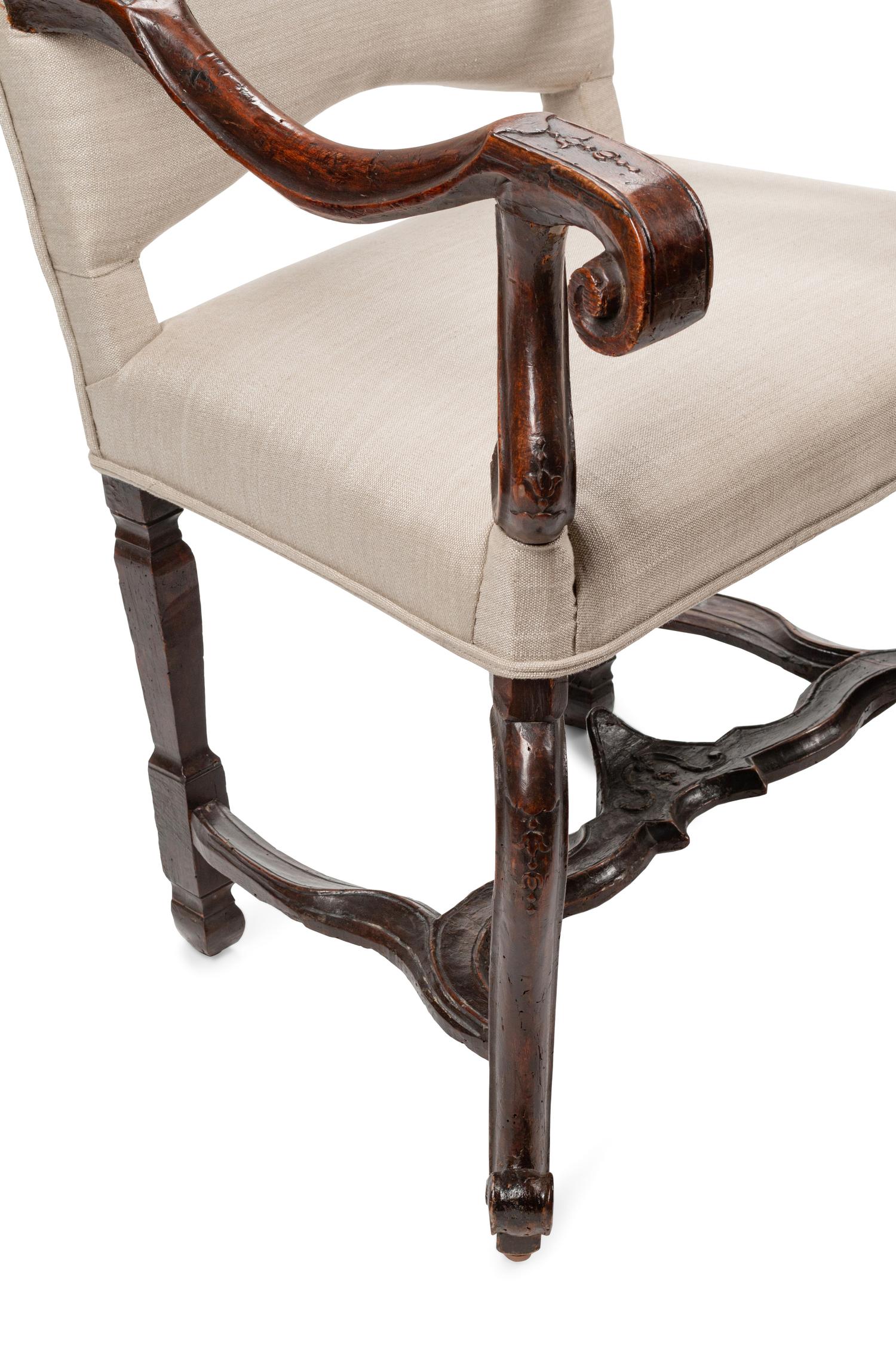 A Pair of Régence Carved Walnut Fauteuils