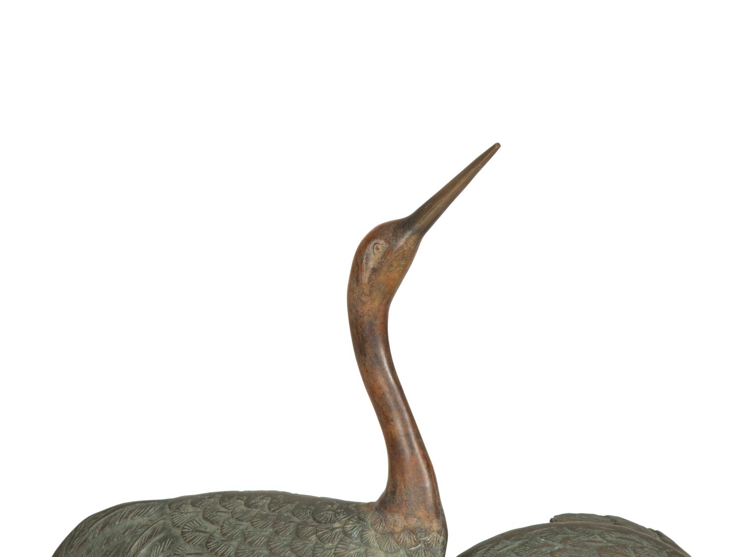 A Bronze Sculpture of Four Standing Cranes