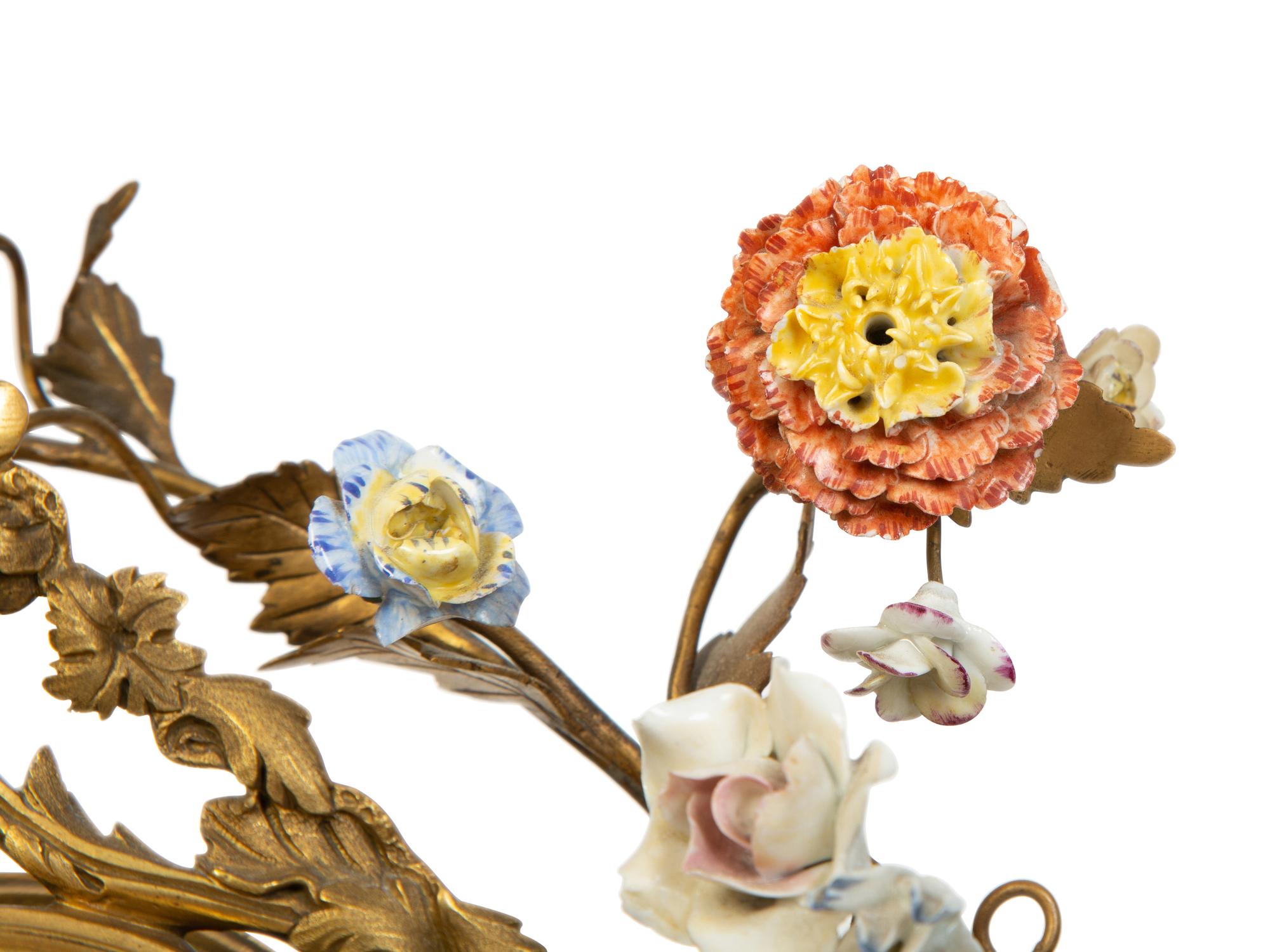 A Continental Gilt Bronze and Porcelain Figural Mantel Clock