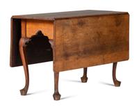 A Queen Anne Carved Walnut Drop-Leaf Dining Table