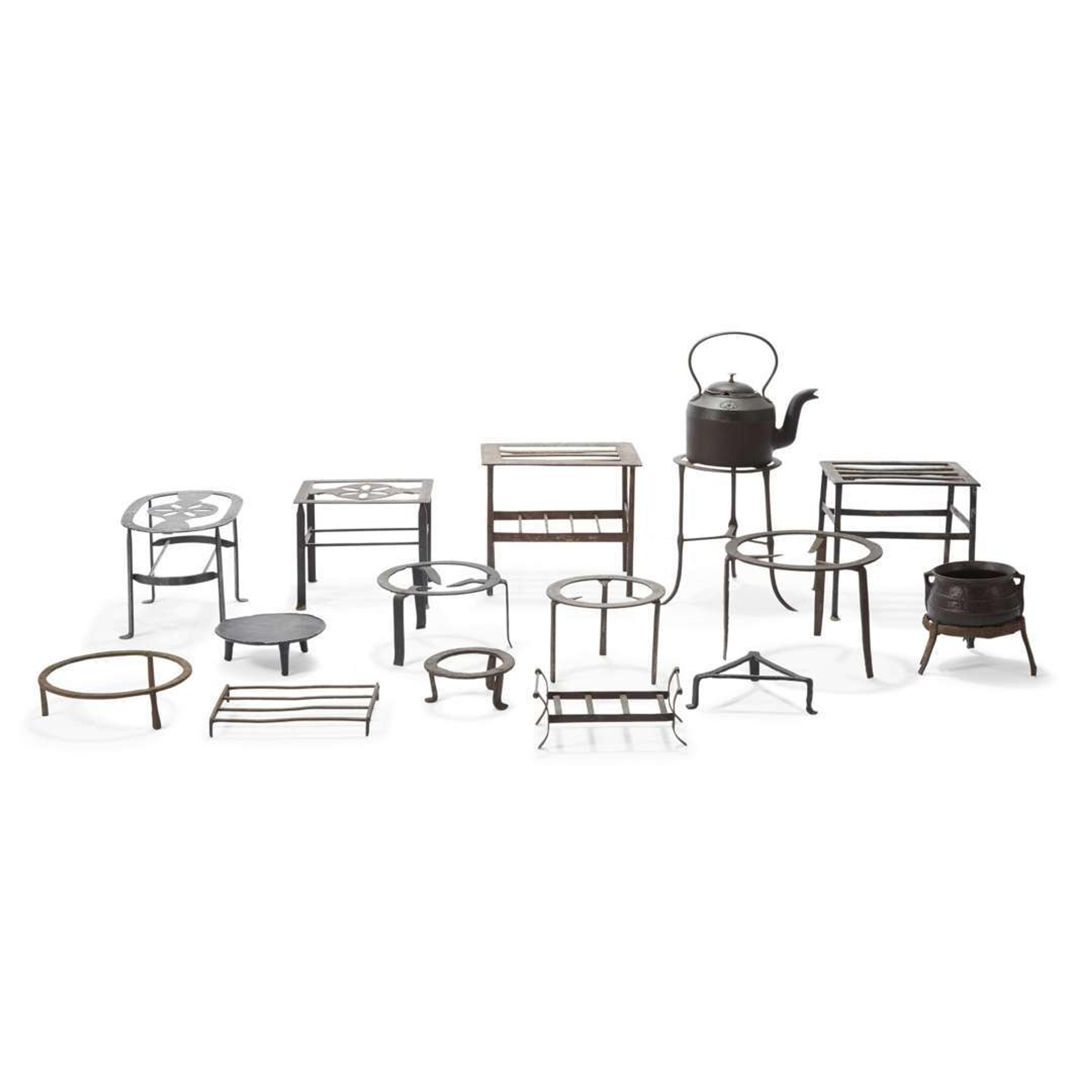 Group of fifteen wrought and cast iron footmen and trivets and a cast iron pot and kettle Kettle marked T. Sheldon & Co., 18th/19th century