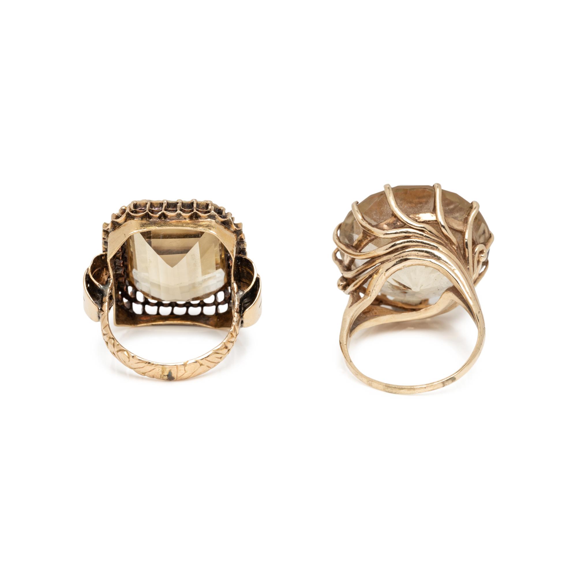 TWO CITRINE AND YELLOW GOLD RINGS