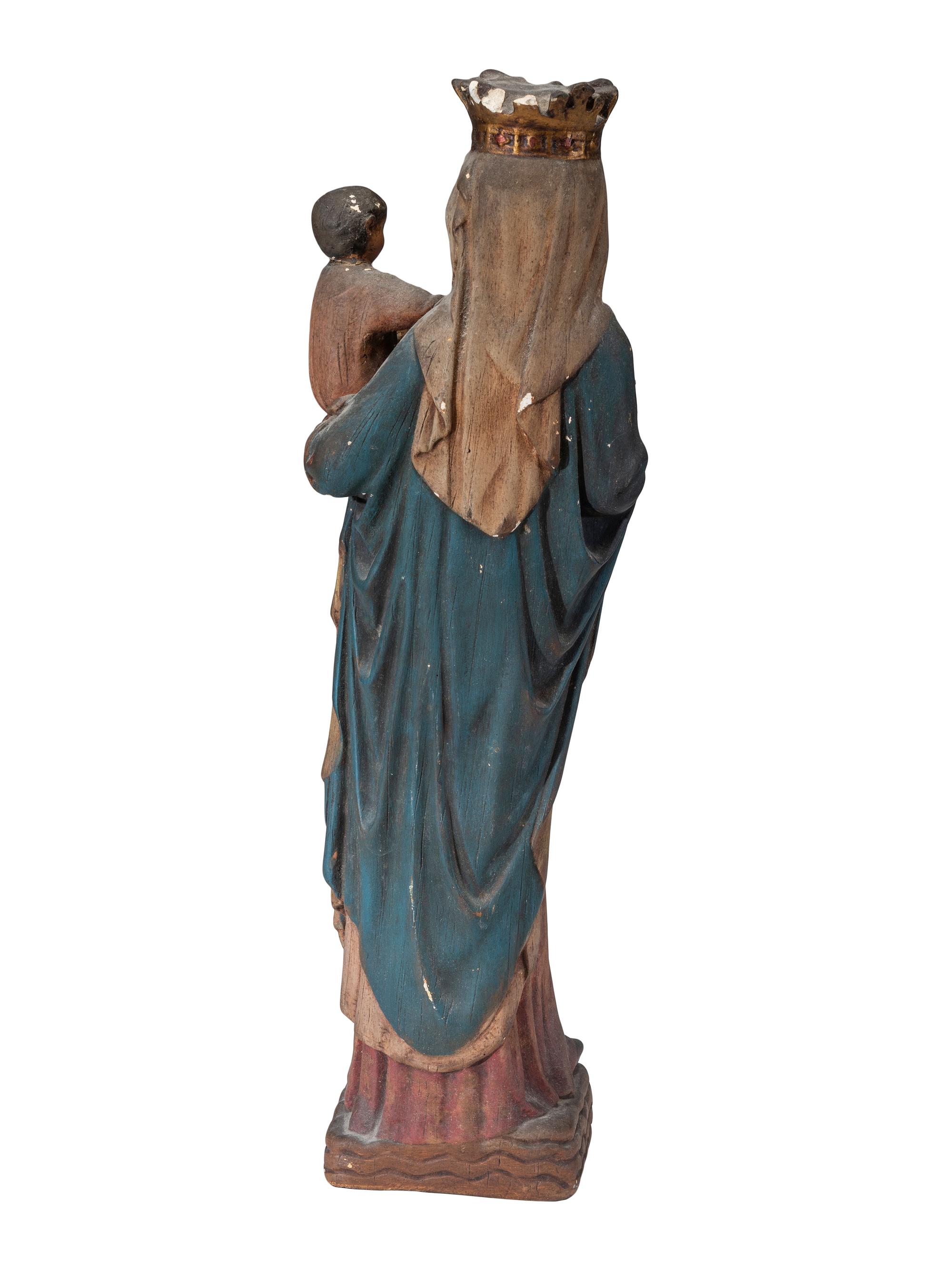 A Continental Paint Decorated Chalkware Santos Figure of the Madonna and Child