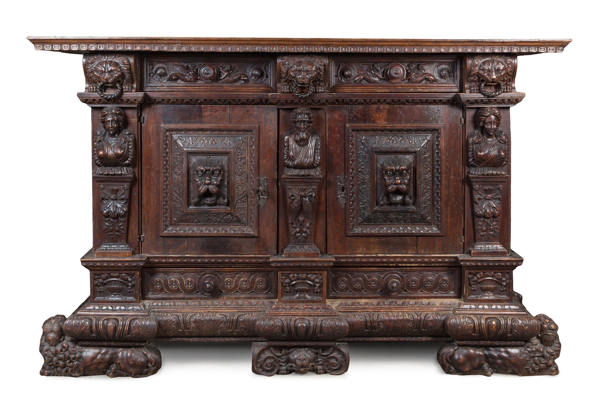 A German Relief Carved Oak Cabinet Height 55 3/4 x width 86 1/2 x depth 27 1/4 inches. — 17TH CENTURY