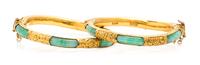 A Pair of High Karat Yellow Gold and Jade Bangle Bracelets, 44.10 dwts.
