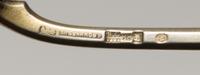 A Russian Silver-Gilt and Enamel Spoon, Mark of Ivan Khlebnikov, assay mark of Viktor Savinsky, Moscow, 1888, having a finial topped ha