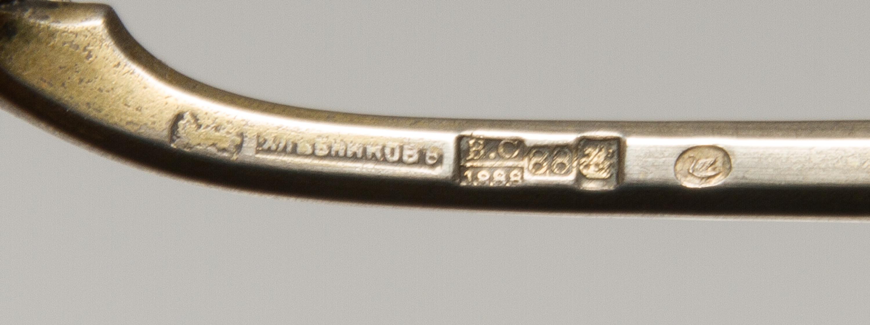 A Russian Silver-Gilt and Enamel Spoon, Mark of Ivan Khlebnikov, assay mark of Viktor Savinsky, Moscow, 1888, having a finial topped ha