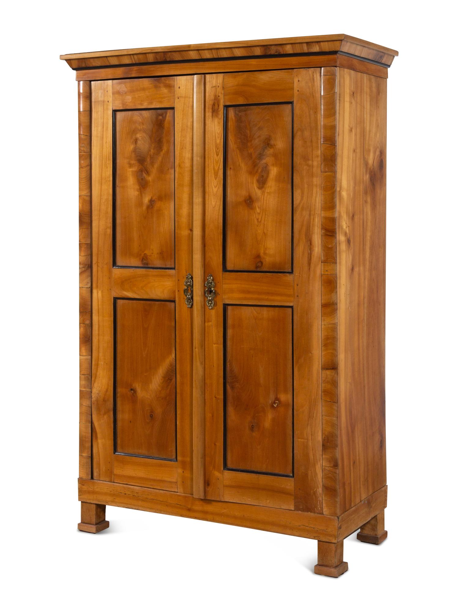 A Biedermeier Parcel Ebonized Birch Armoire