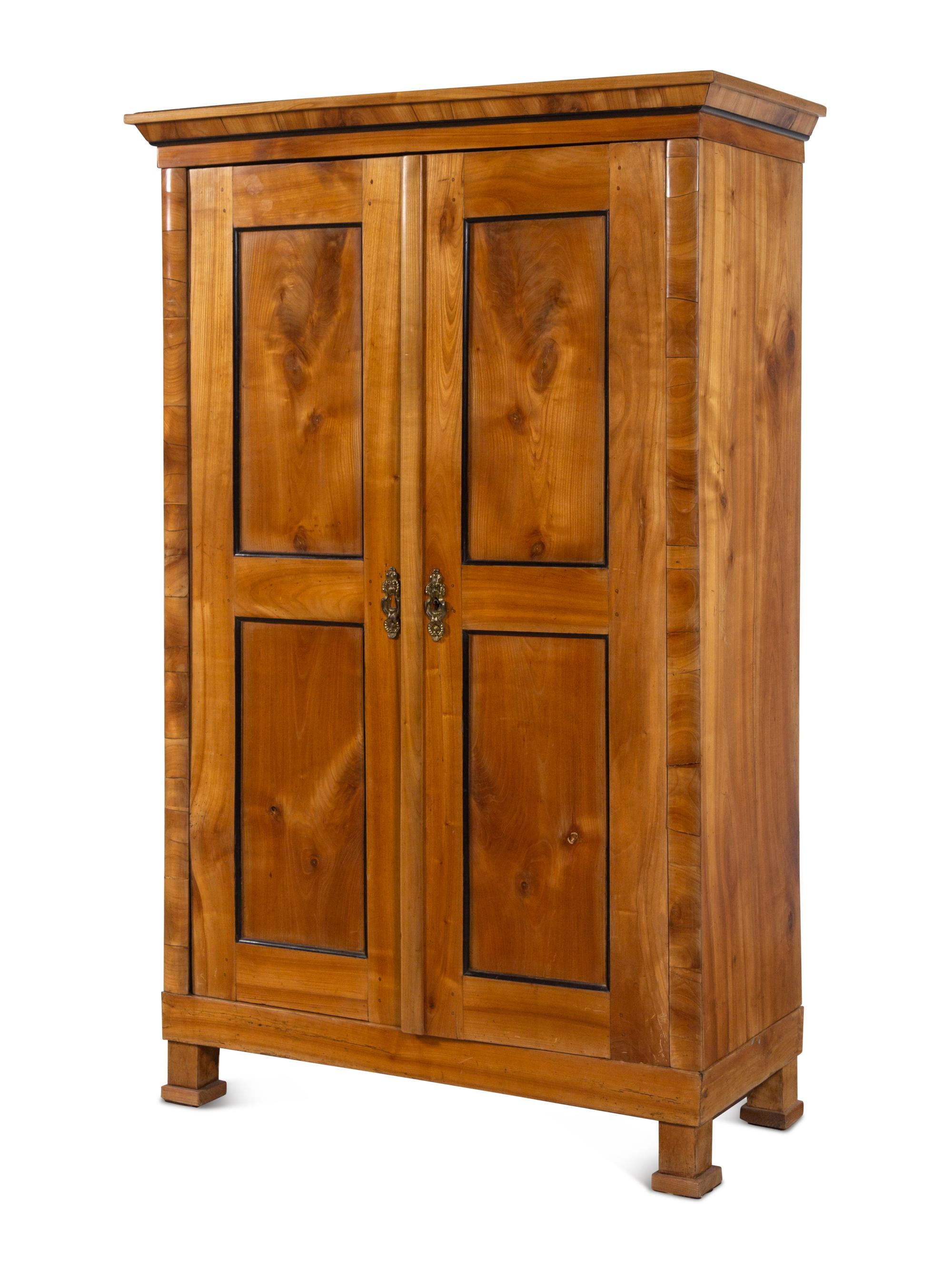 A Biedermeier Parcel Ebonized Birch Armoire