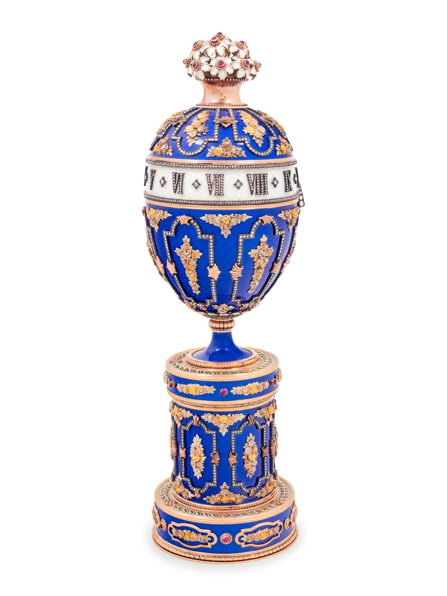 A Gold, Enamel and Diamond Inset Egg-Form Annular Clock