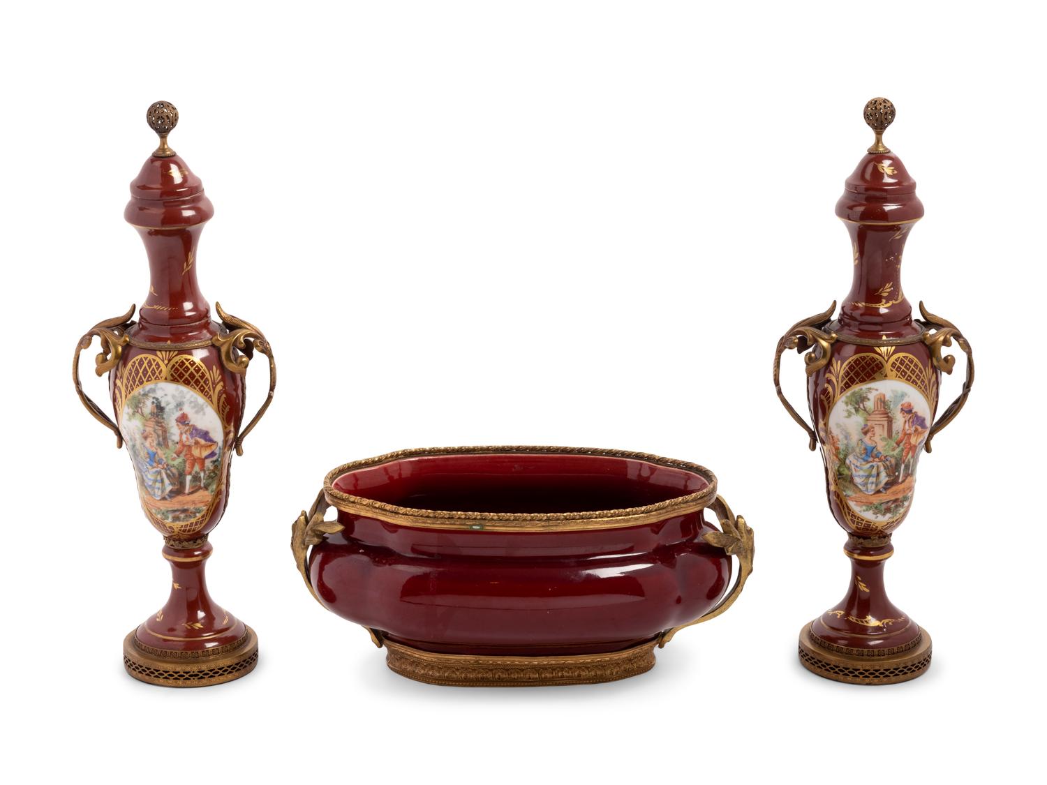 An Assembled French Gilt Metal Mounted Porcelain and Pottery Garniture