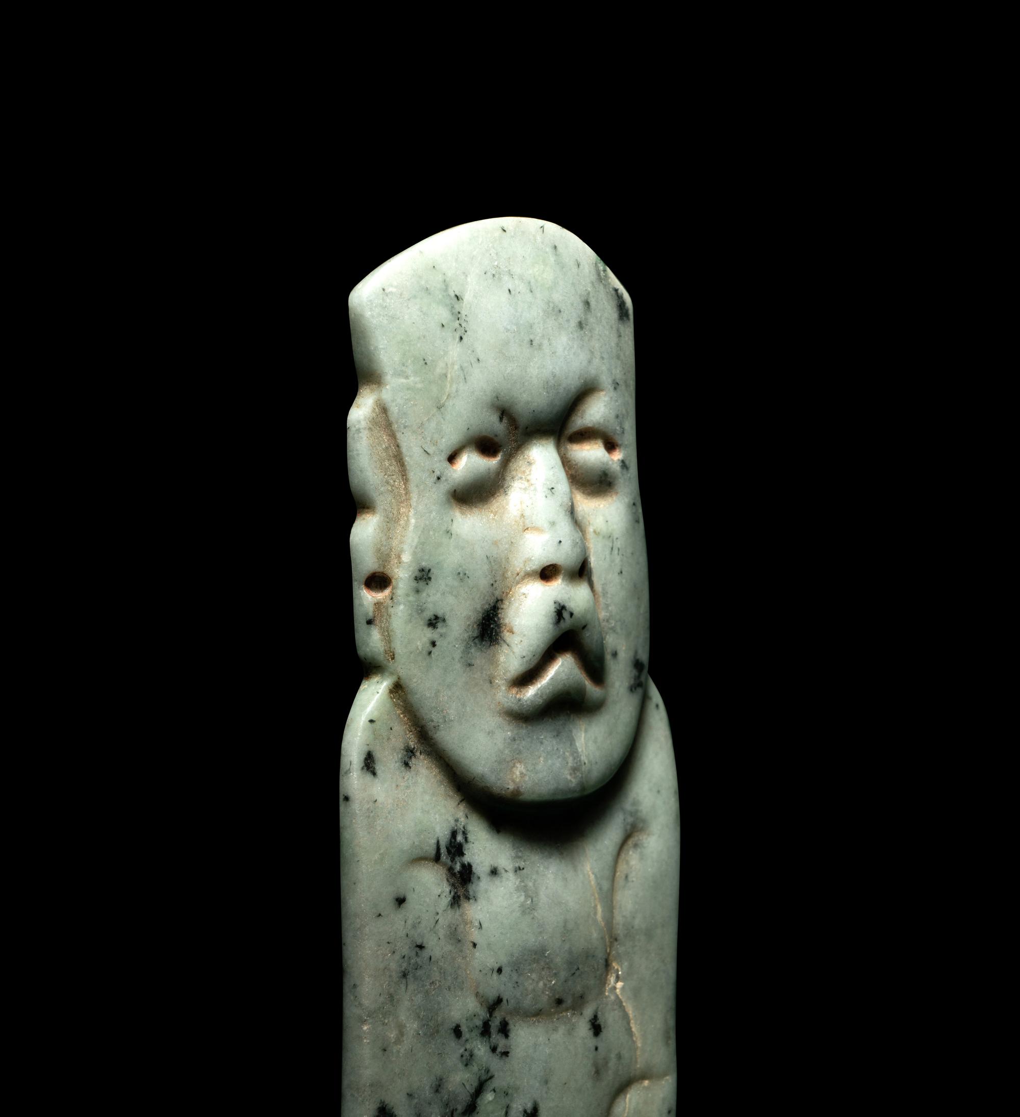 An Olmec Jade Figural Celt