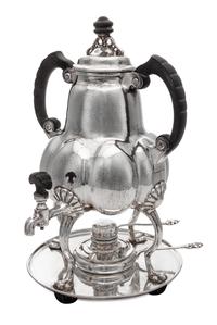 A German Silver Kettle on Lampstand, Bremer Werkstatten fur Kunstgewerbliche Silberarbeiten, Early 20th Century, having an ebonized fin
