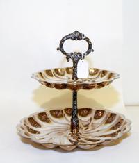 An American Silver-Plate Two-Tiered Cake Stand, F.B. Rogers Silver Co., Shelburne Falls, MA, each tier having an undulating rim with a