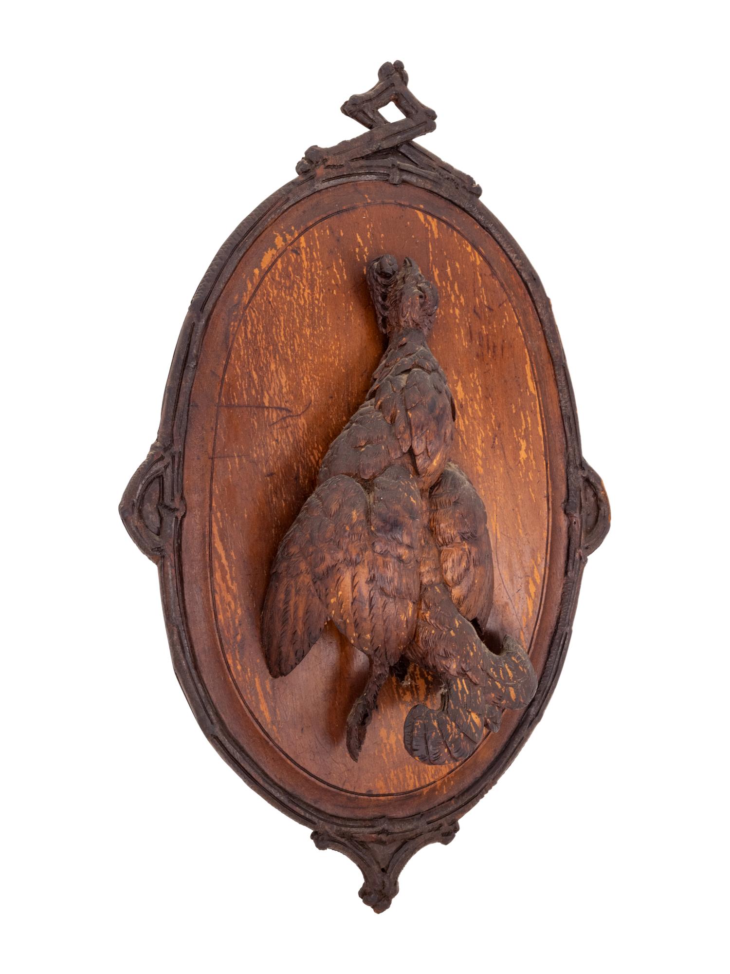 A Black Forest Carved Game Plaque