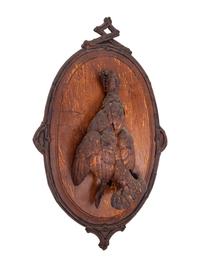 A Black Forest Carved Game Plaque