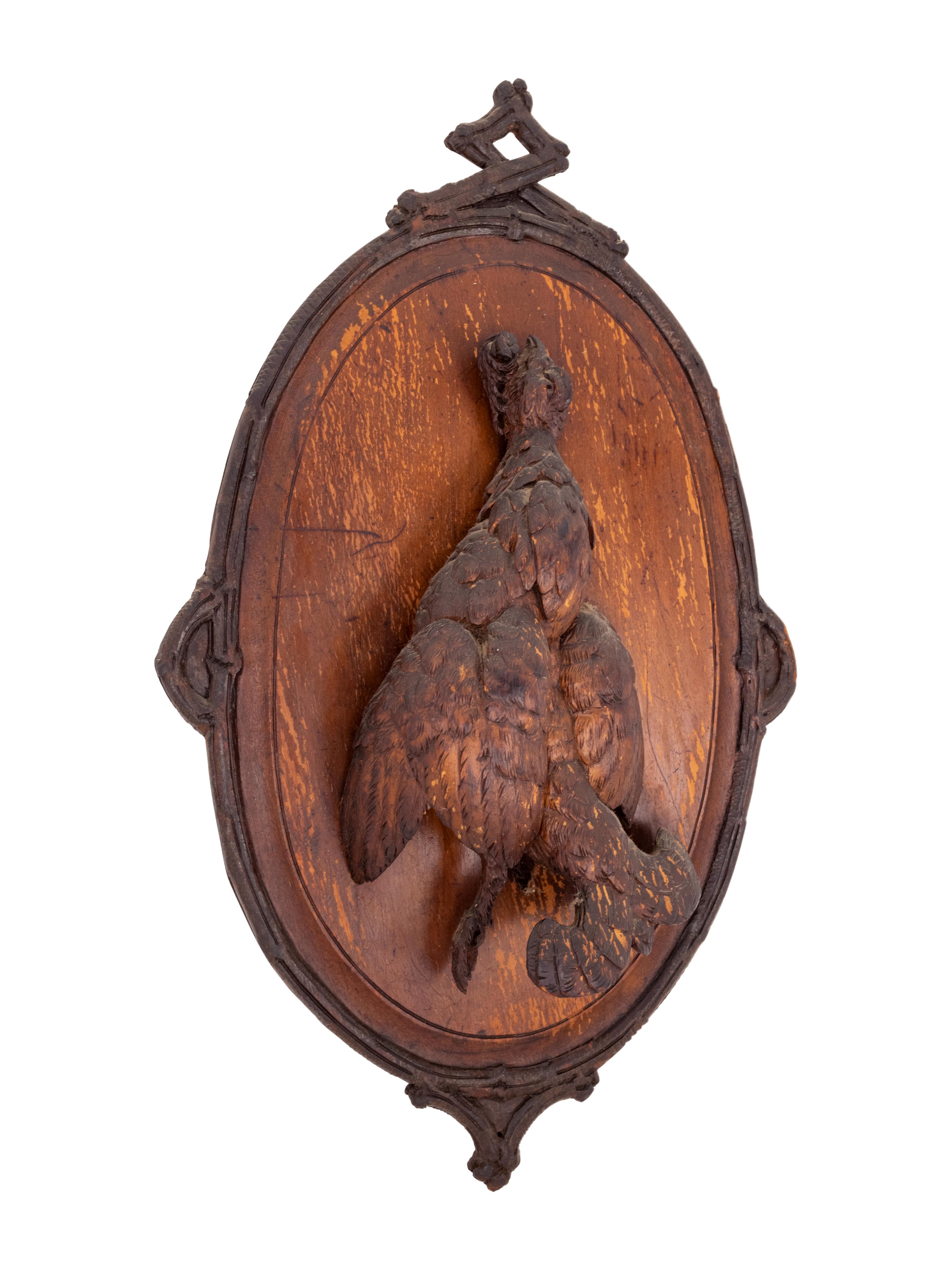 A Black Forest Carved Game Plaque