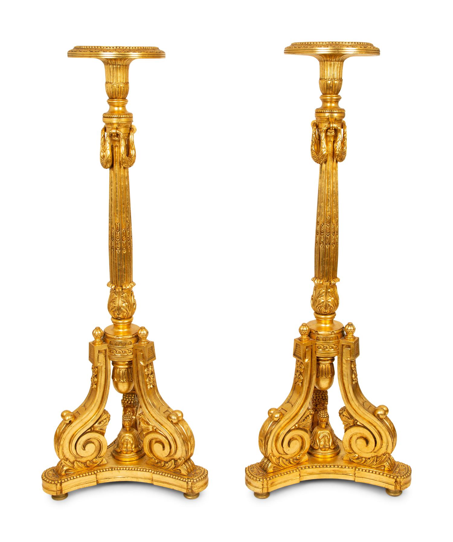 A Pair of Louis XVI Style Giltwood Torcheres — 20TH CENTURY